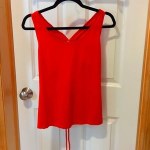 Medium burnt orange Fabletics workout tank. Cutout and tie in the back.
